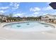 Large in-ground community pool with many chairs, tables, and umbrellas for resident use at 1884 Copelyn Reese Court (Lot 166), Lawrenceville, GA 30043
