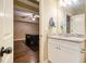 Bathroom featuring a modern granite vanity adjacent to a game room at 27 Rose Brooke Cir, White, GA 30184