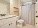 Neutral bathroom featuring granite countertops, white cabinets, and a shower with gray-and-white striped curtain at 27 Rose Brooke Cir, White, GA 30184