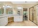 Bathroom showcasing double vanity with granite countertops and a separate walk-in shower at 27 Rose Brooke Cir, White, GA 30184