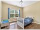 Bright bedroom featuring hardwood floors and natural light at 27 Rose Brooke Cir, White, GA 30184