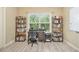 Versatile bedroom space with desk, large window, shelving, and ample natural light at 27 Rose Brooke Cir, White, GA 30184