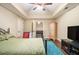 Bedroom featuring hardwood floors, a ceiling fan, and a stylish decor at 27 Rose Brooke Cir, White, GA 30184