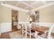 Charming dining room with a view to the kitchen and stairway at 27 Rose Brooke Cir, White, GA 30184