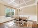 Bright dining room with a decorative ceiling, hardwood floors, and large windows at 27 Rose Brooke Cir, White, GA 30184