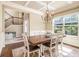 Elegant dining room featuring a coffered ceiling, hardwood floors, and natural light at 27 Rose Brooke Cir, White, GA 30184