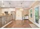 Open kitchen with wood-look accents, modern appliances, and seamless flow to the outdoors at 27 Rose Brooke Cir, White, GA 30184