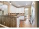 Well-equipped kitchen featuring granite countertops, stainless appliances, and a wood paneled breakfast bar at 27 Rose Brooke Cir, White, GA 30184
