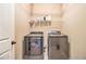 Well-equipped laundry room with modern front-load washer and dryer at 27 Rose Brooke Cir, White, GA 30184