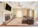 Cozy living room featuring hardwood floors, a stone fireplace, and comfortable seating at 27 Rose Brooke Cir, White, GA 30184