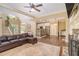 Open-concept living room with hardwood floors, a fireplace, and seamless flow to the kitchen at 27 Rose Brooke Cir, White, GA 30184