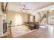 Spacious living room with hardwood floors, a stone fireplace, and a leather sectional sofa, creating a cozy atmosphere at 27 Rose Brooke Cir, White, GA 30184