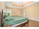 Light-filled main bedroom featuring hardwood floors, an ensuite bathroom, and an open space at 27 Rose Brooke Cir, White, GA 30184