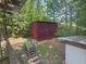 A backyard featuring a shed among the lush greenery and foliage at 7125 Chappell Cir, Atlanta, GA 30360