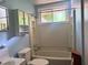 Bathroom featuring a bathtub, a shower, a toilet, and a vanity, all under a window providing natural light at 7125 Chappell Cir, Atlanta, GA 30360