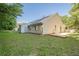 Large backyard featuring a generous grassy area, storage shed and a covered structure at 1249 Scripps Sw Ct, Marietta, GA 30008