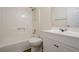Bright bathroom featuring a shower-tub combo, single sink vanity and modern fixtures at 1249 Scripps Sw Ct, Marietta, GA 30008