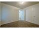 Cozy bedroom featuring neutral paint, plush carpeting and an entry door at 1249 Scripps Sw Ct, Marietta, GA 30008