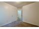 Bedroom featuring neutral walls and carpet, with an adjoining bathroom entrance at 1249 Scripps Sw Ct, Marietta, GA 30008