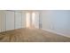 Carpeted bedroom with double closets, neutral walls, and multiple entryways at 1249 Scripps Sw Ct, Marietta, GA 30008