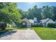 Charming single story home with brick and vinyl siding, manicured lawn, and a long driveway at 1249 Scripps Sw Ct, Marietta, GA 30008