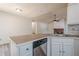 Updated kitchen featuring stainless steel appliances and a breakfast bar overlooking the living room at 1249 Scripps Sw Ct, Marietta, GA 30008