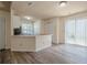 Open-concept living area with light-filled sliding glass doors and a view of the kitchen at 1249 Scripps Sw Ct, Marietta, GA 30008