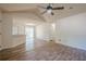 A bright living room featuring a ceiling fan, door to the outside, and hardwood floors at 1249 Scripps Sw Ct, Marietta, GA 30008