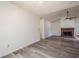 Open living room features wood-look flooring and a decorative fireplace at 1249 Scripps Sw Ct, Marietta, GA 30008
