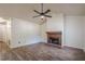 A bright living room featuring a ceiling fan, fire place, and hardwood floors at 1249 Scripps Sw Ct, Marietta, GA 30008