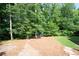 A spacious backyard featuring mature trees and natural surroundings, perfect for outdoor activities and relaxation at 2968 Ovalene Sw Ct, Marietta, GA 30064