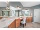 Bathroom with dual vanities, a makeup counter, and ample mirror space at 2968 Ovalene Sw Ct, Marietta, GA 30064