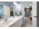 Bathroom featuring a double sink vanity, tiled floors, and neutral blue walls at 2968 Ovalene Sw Ct, Marietta, GA 30064
