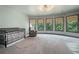 Bright bedroom with curved window, natural light, and a cozy rocking chair at 2968 Ovalene Sw Ct, Marietta, GA 30064