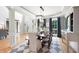 Dining room with hardwood floors, a modern chandelier, and a view into the front foyer at 2968 Ovalene Sw Ct, Marietta, GA 30064