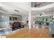 Open dining area featuring hardwood floors, a modern light fixture, and a bench-style dining table at 2968 Ovalene Sw Ct, Marietta, GA 30064