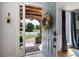 Inviting entryway with an open door view of lush landscaping and a charming neighborhood at 2968 Ovalene Sw Ct, Marietta, GA 30064