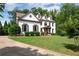 Charming home with a well-manicured lawn, beautiful landscaping, and a welcoming front entrance at 2968 Ovalene Sw Ct, Marietta, GA 30064