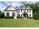 Beautiful two-story home with a lush green lawn and professionally landscaped flowerbeds at 2968 Ovalene Sw Ct, Marietta, GA 30064