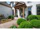 Inviting front porch with wood columns, a decorative wreath, and manicured landscaping at 2968 Ovalene Sw Ct, Marietta, GA 30064
