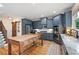 Kitchen with stainless steel appliances, a rustic island, granite countertops, and hardwood floors at 2968 Ovalene Sw Ct, Marietta, GA 30064