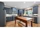 Stylish kitchen with grey cabinets, wood island, subway tile backsplash, and modern stainless steel appliances at 2968 Ovalene Sw Ct, Marietta, GA 30064