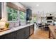 Bright kitchen featuring stylish countertops, grey cabinets, stainless steel appliances, and view to adjacent rooms at 2968 Ovalene Sw Ct, Marietta, GA 30064