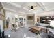Open-concept living room with coffered ceiling, neutral tones, and seamless transition to other living spaces at 2968 Ovalene Sw Ct, Marietta, GA 30064