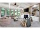 Bright living room with large windows, a fireplace, and built-in shelving at 2968 Ovalene Sw Ct, Marietta, GA 30064