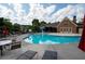 Community pool featuring lounge chairs, umbrellas, and a play area with ample seating at 2968 Ovalene Sw Ct, Marietta, GA 30064