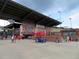 Coolray Field Entrance with large logo, ticket windows, concession stand, and numerous visitors on a cloudy day at 1882 Copelyn Reese Court (Lot 167), Lawrenceville, GA 30043