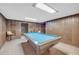 Finished basement with a pool table and paneled walls at 2320 Tilson Cir, Decatur, GA 30032