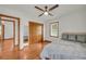 Bright bedroom with hardwood floors, fan, and closet with mirrored doors at 2320 Tilson Cir, Decatur, GA 30032
