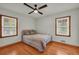 Well-lit bedroom featuring hardwood floors and bright windows at 2320 Tilson Cir, Decatur, GA 30032